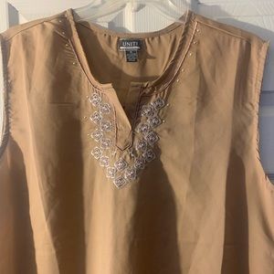 Woman’s Unity tan shirt size 1X with embellishments.